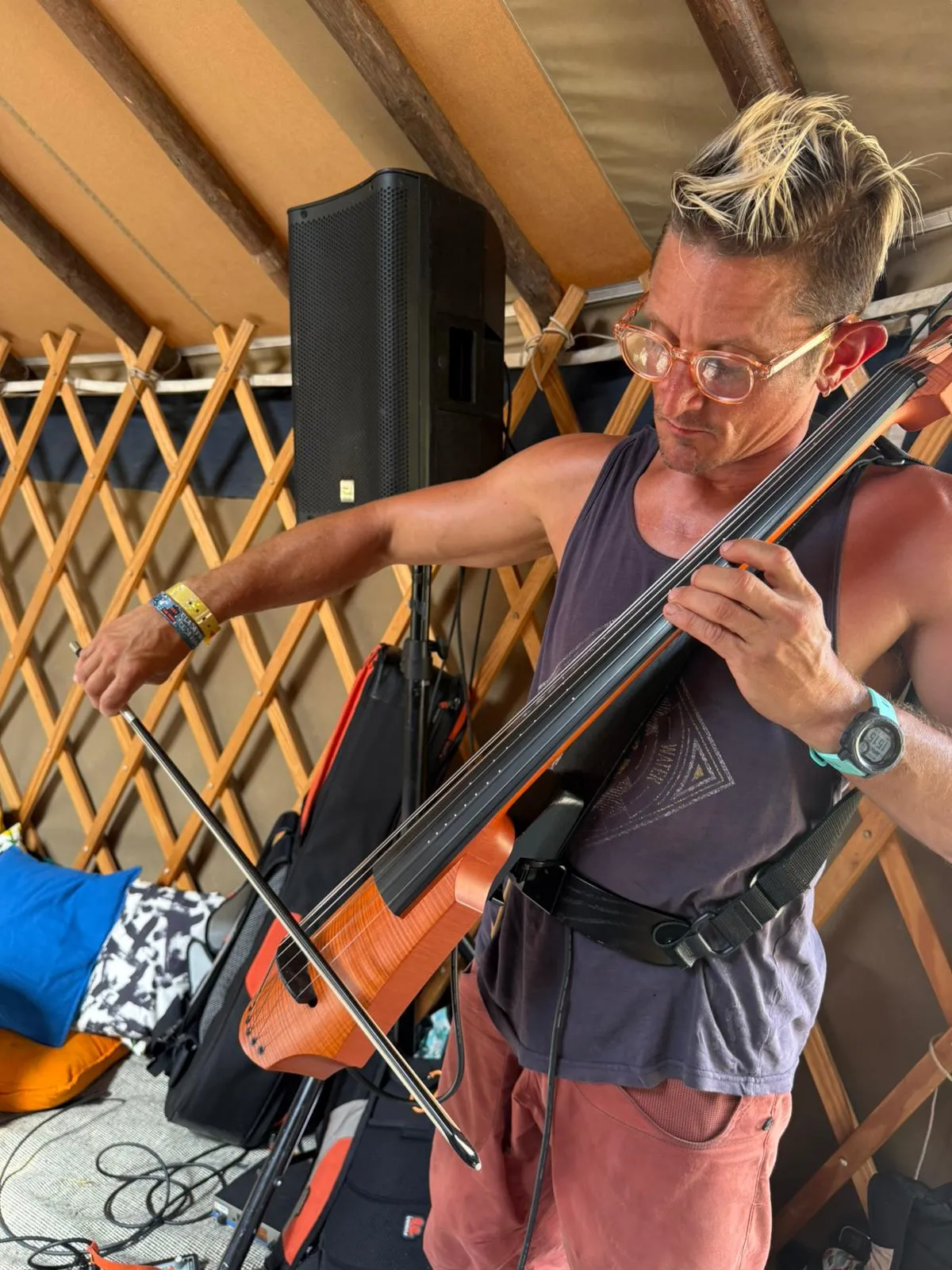 Kester playing cello at Glastonbury